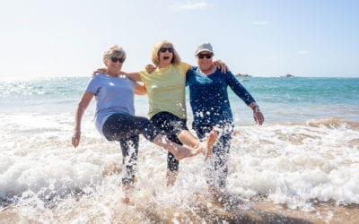Older women playing in the surf