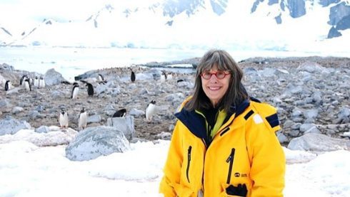 Evelyn Hannon poses with penguins