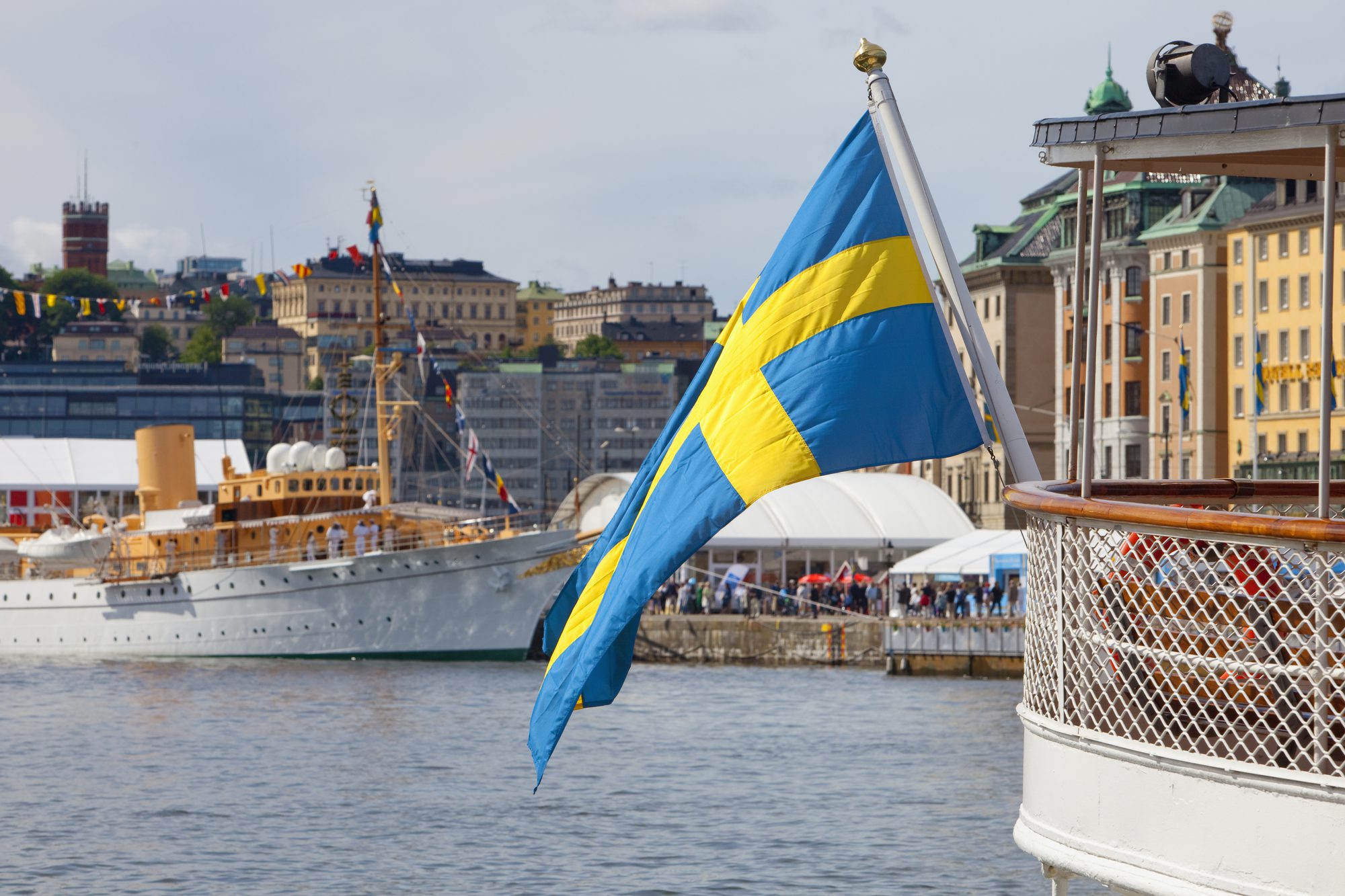 Swedish flag hanging from the back of a ferry boat