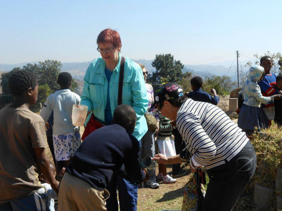 Marti S working at the feeding center in Swaziland