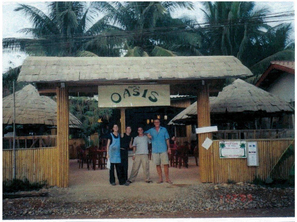 A group stands in front of Hope's Oasis in Laos