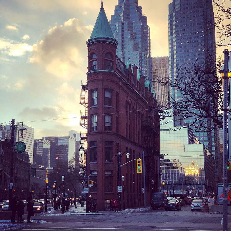 The Flatiron Building in Toronto, Ontario at dusk