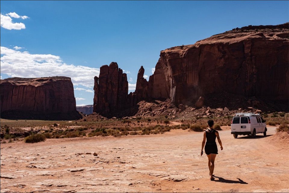 Gillian walking towards her van in Monument Valley