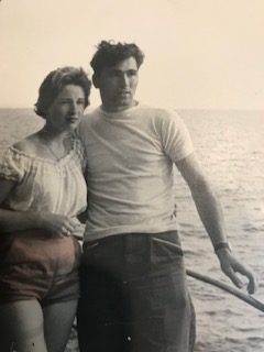 Luigi and Joy on the deck of a boat