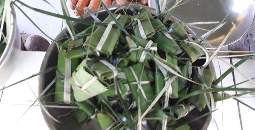 Mango pieces wrapped in banana leaves