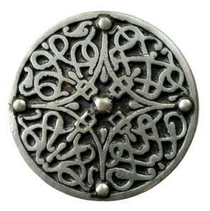 Silver badge with Celtic designs