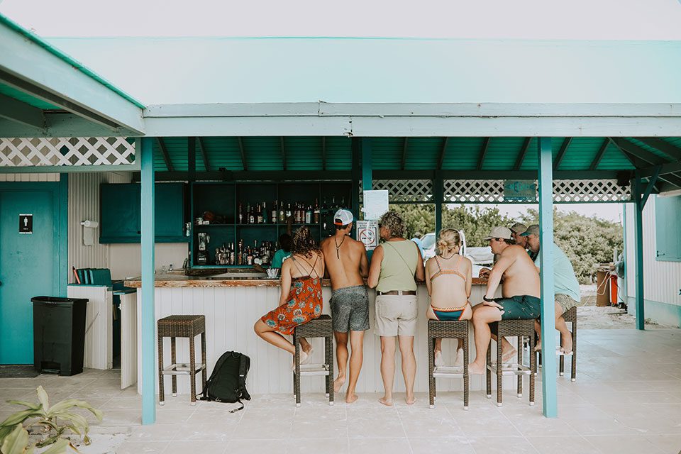 Group of people sitting at an island bar