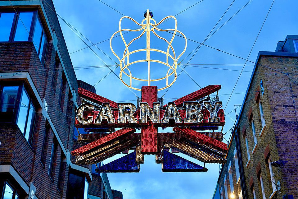 Carnaby Street sign with British flag and crown