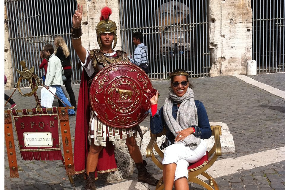 Nadine L with a gladiator at the Colosseum in Rome, Italy