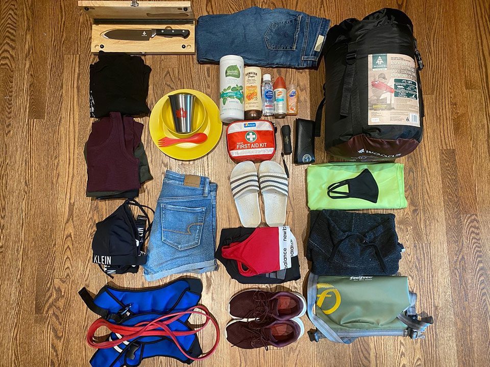 Flat lay detail of what JourneyWoman editor Amanda takes in her carry-on on road trips