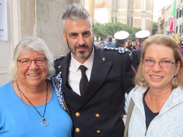 Sally Peabody and friend Joanne pose with a navy band singer in Venice, Italy
