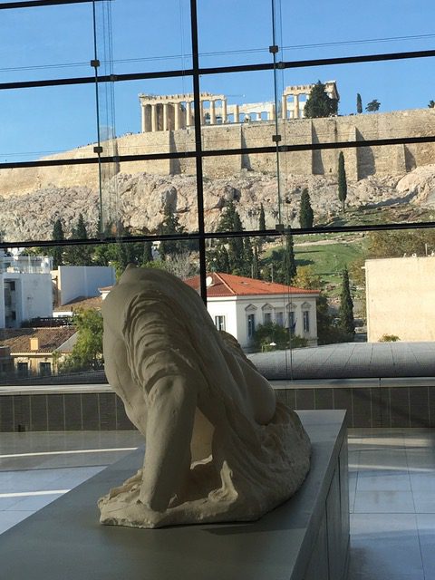 Interior view of Acropolis Museum and sculpture of a lion