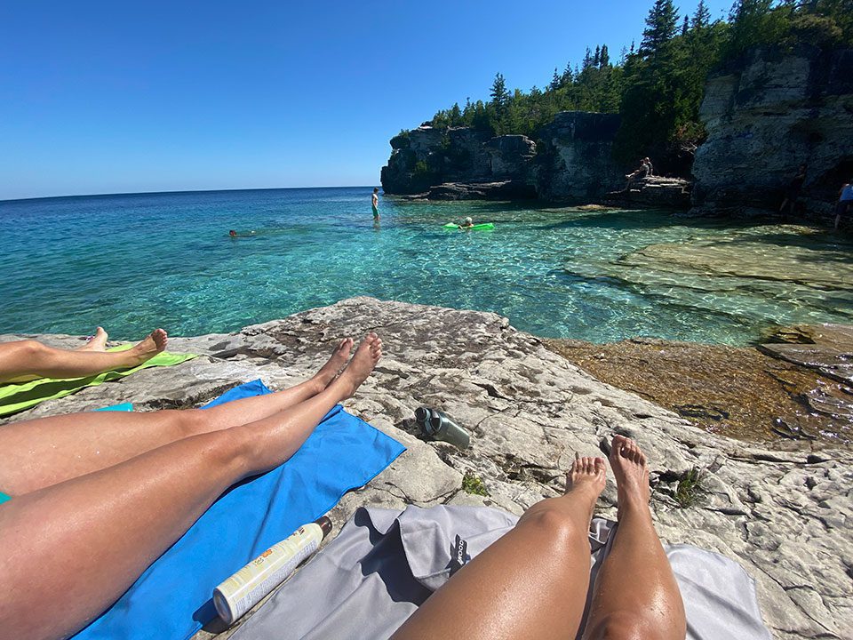 Womens legs and a view of the Grotto