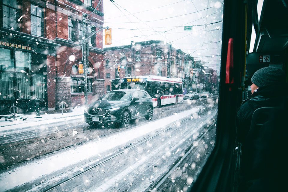 View of downtown Toronto streets in a snowstorm from a streetcar window