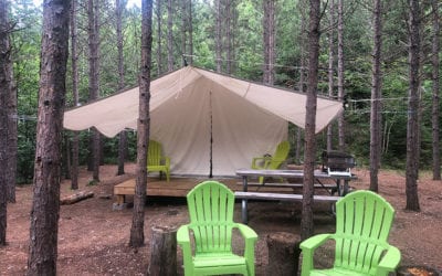 Glamping vs camping campground with covered seating