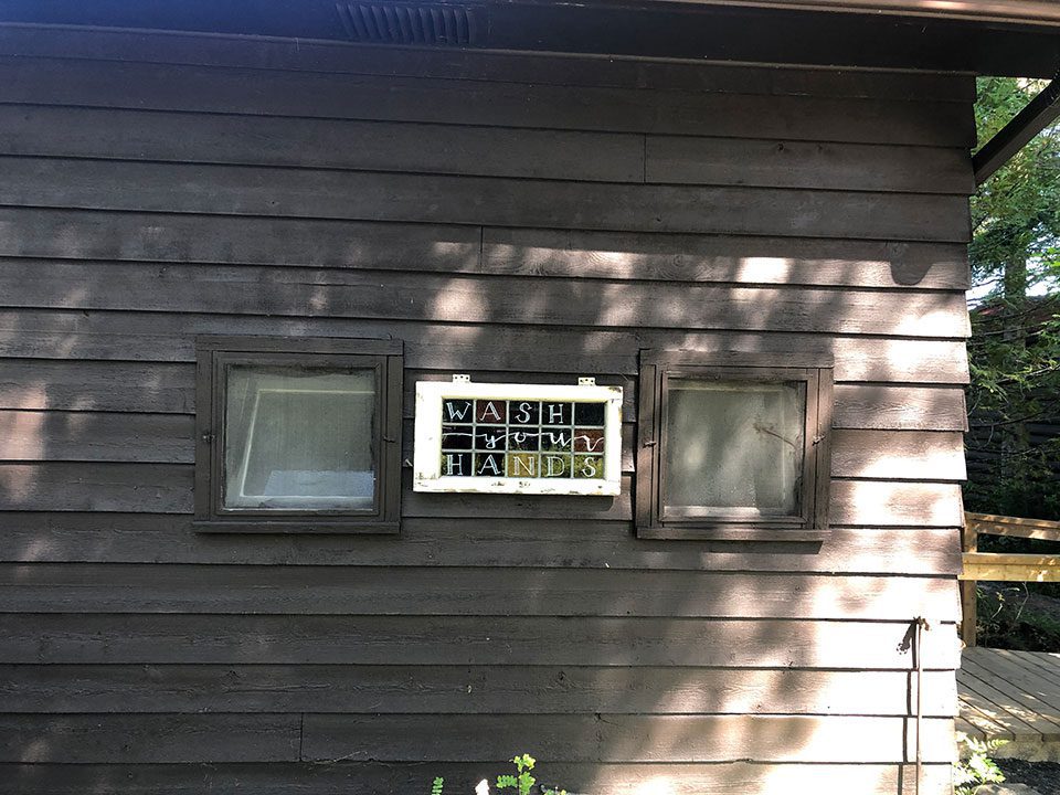 Old cabin windows used as signs
