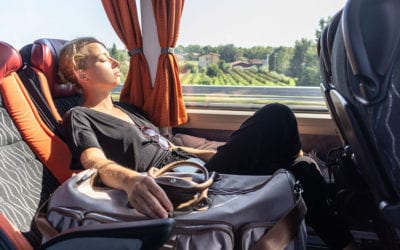 Young woman sleeps on train