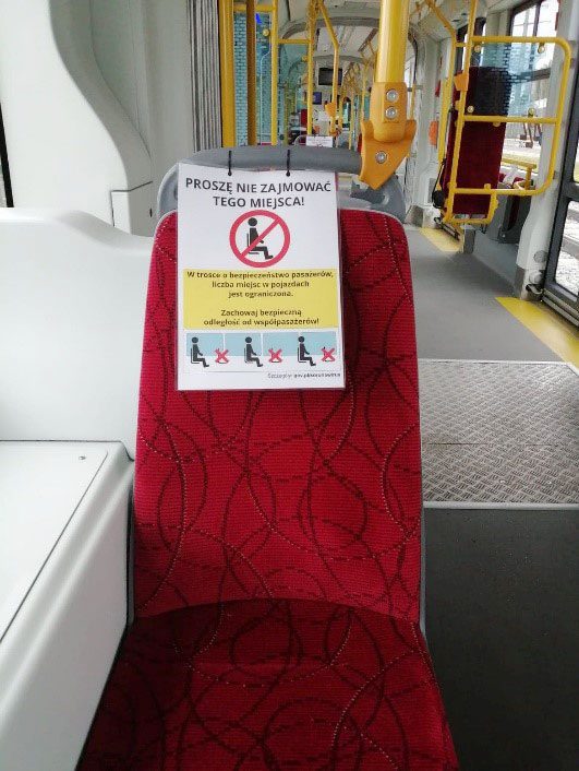 A sign shows passengers not to sit on the marked seats