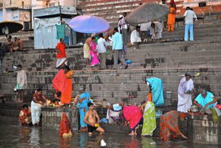 Groups of people along the Ganges River