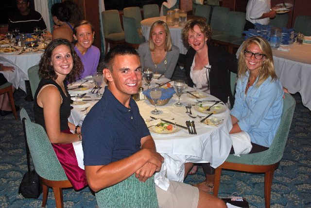 Marillee sits at a table with others