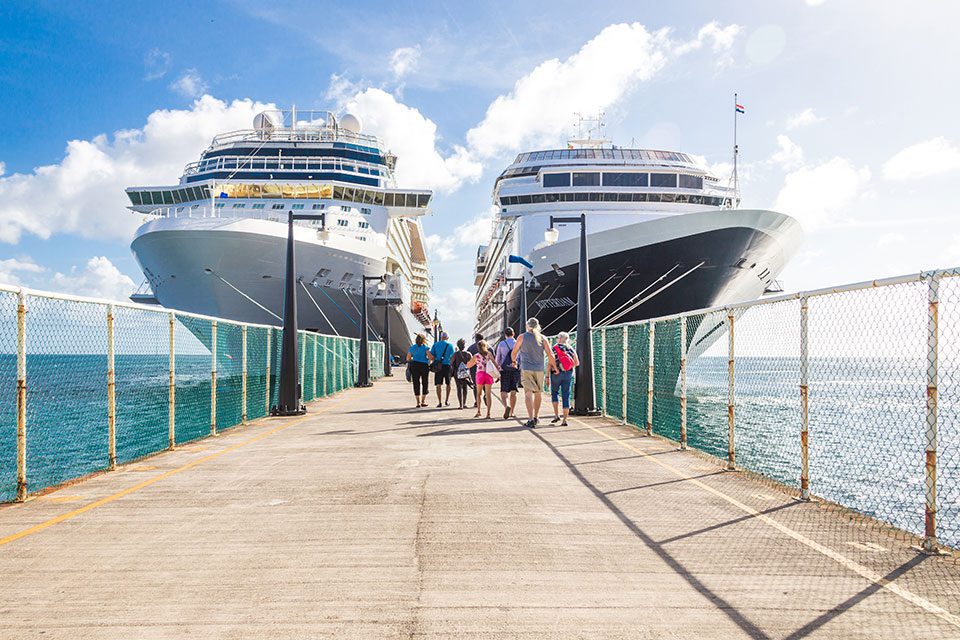 Cruise ship passengers return to their ships at dock