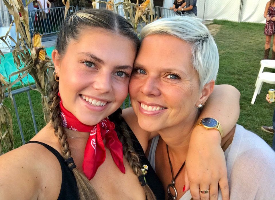 A close up selfie of a young woman and her mother