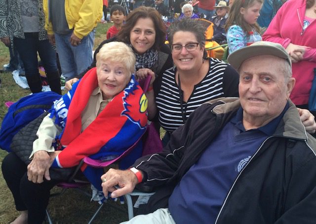 Sue with two smiling eldery folks