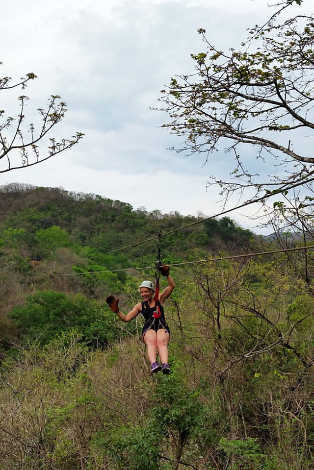 Amanda demonstrates ziplining in Costa Rica