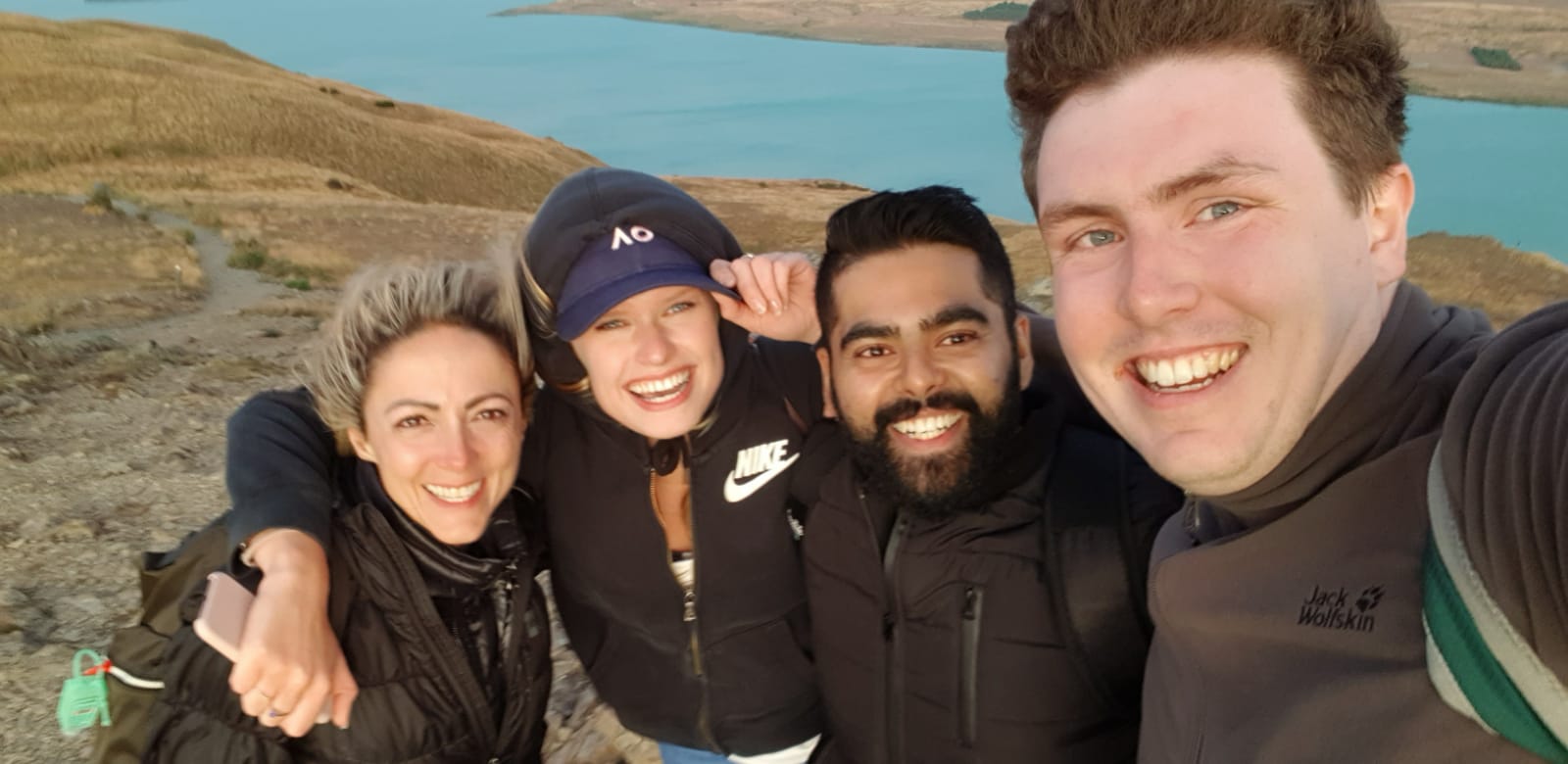 Amanda (left) with her new friends Lucie, Faraaz and Hugh at the summit of Mount John in the Aoraki Mackenzie International Dark Sky Reserve