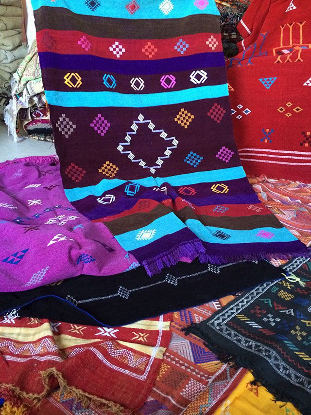Colourful rugs in a Moroccan souk