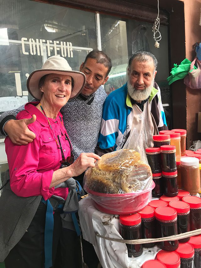 Tita samples honey in New Zealand with local shopkeepers