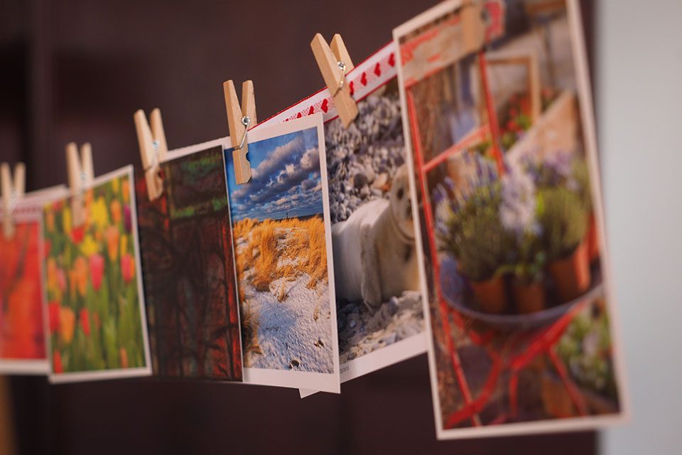 Postcards hanging on a wire