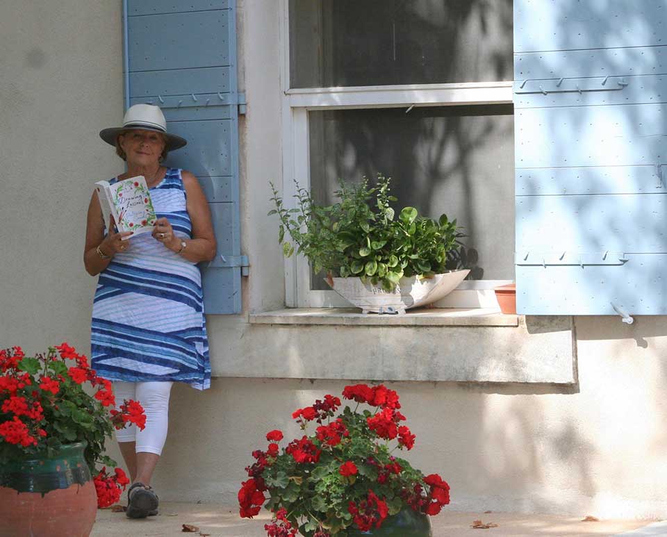 Patricia Sands reads a book in France