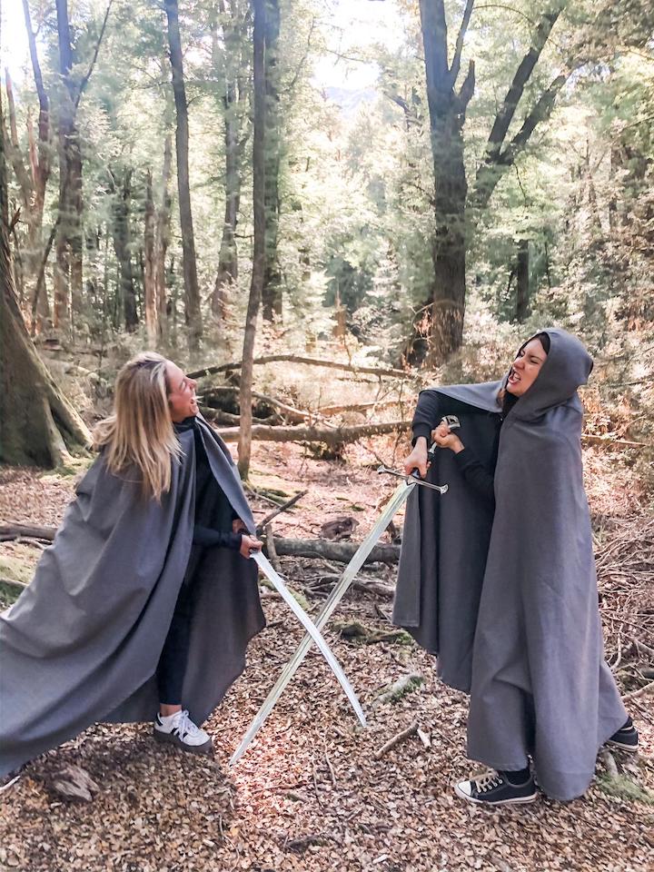 Amanda and Brit Ellie enjoy some LOTR swordplay in a forest glen