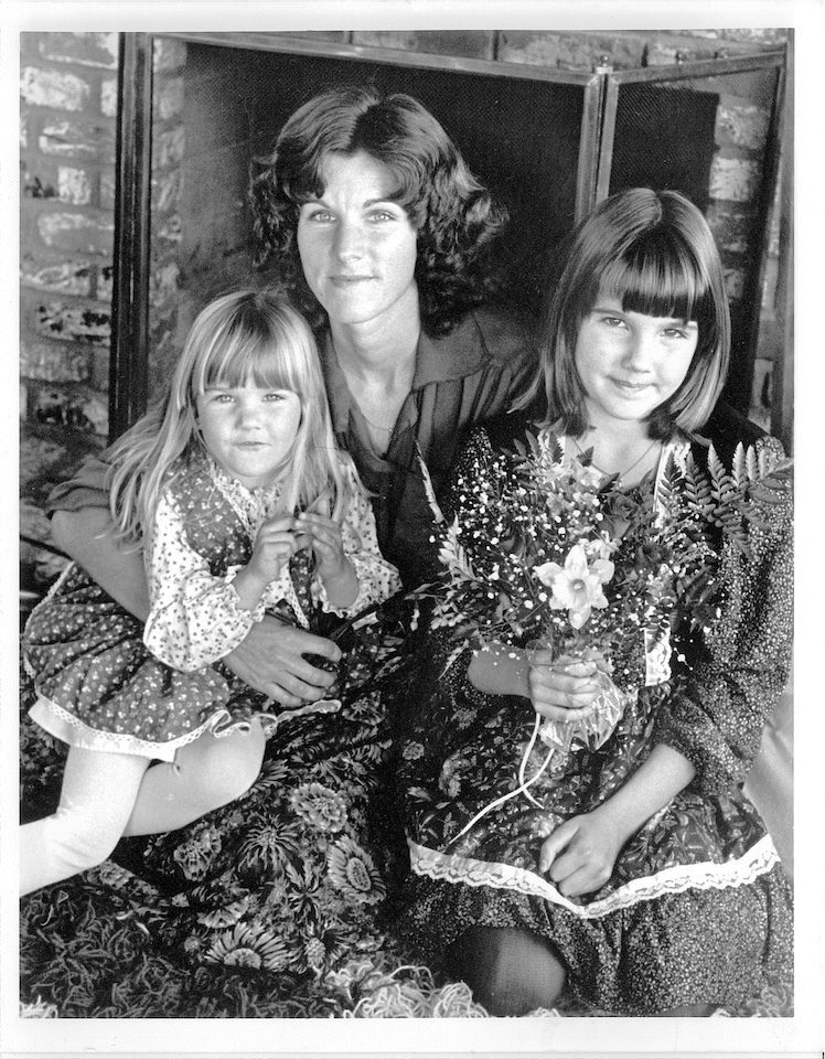 Three women in a black and white photo