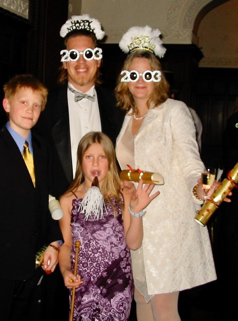 A family wearing accessories to celebrate New Years Eve