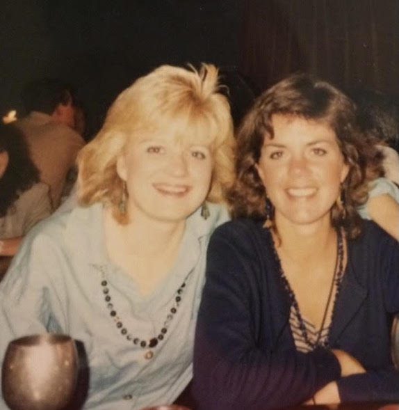 Two women smiling at the camera