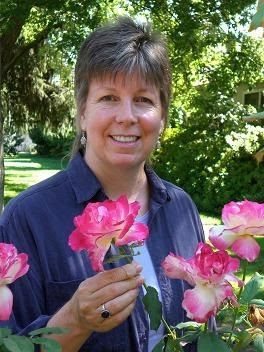 Kate Savory holding a pink flower