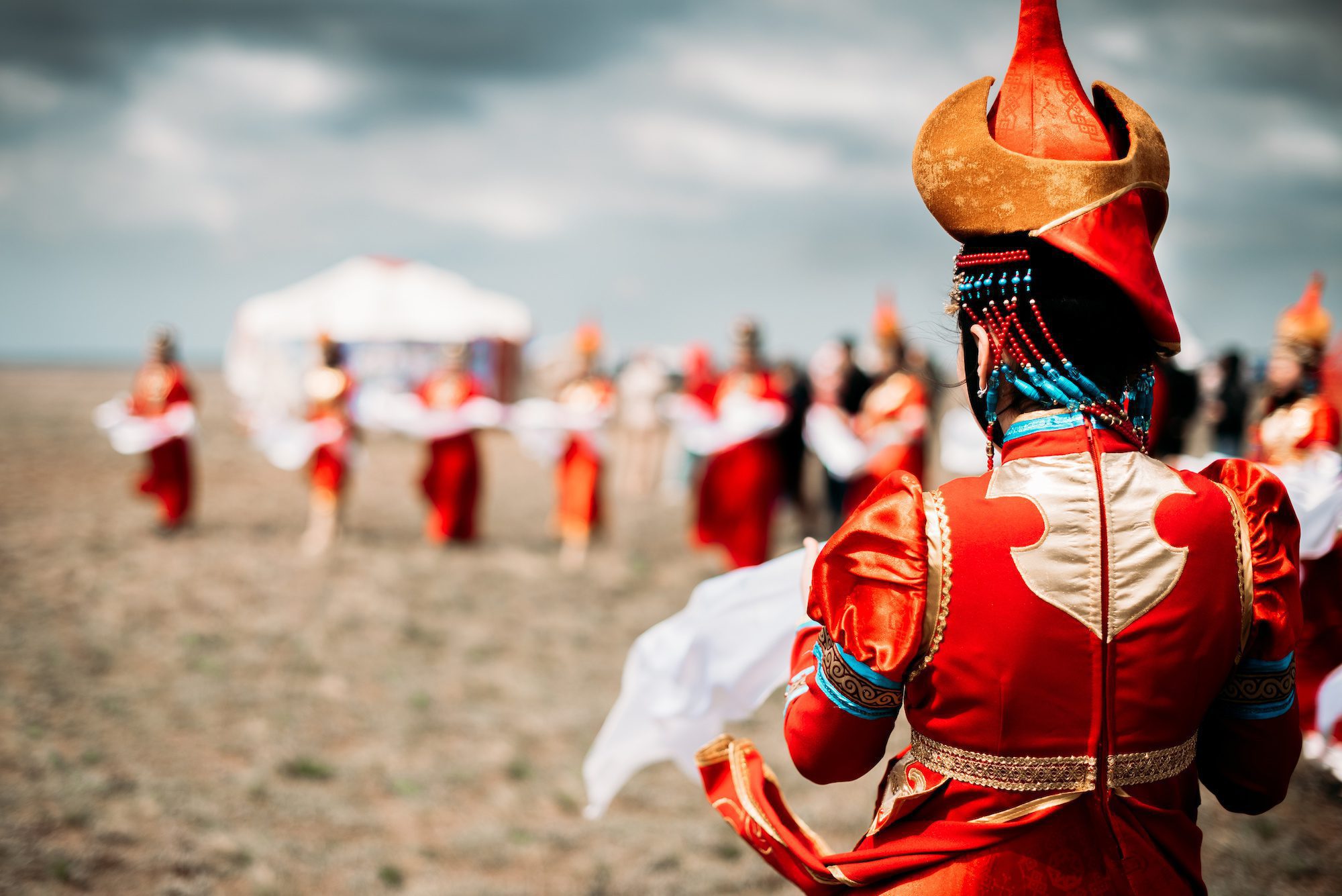 Photo of young beautiful women wearing in traditional national mongolian kalmykian dresses in the festival