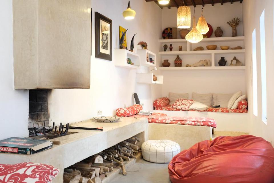 Nooks and crannies stuffed with pillows and objets d'art make this space cozy and interesting