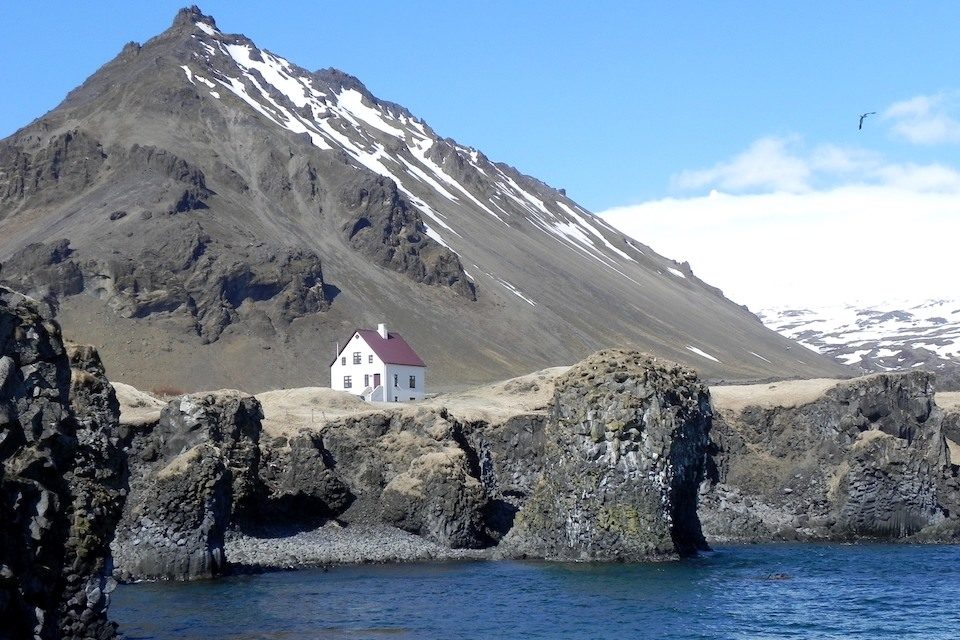 A tiny home sitting beside the ocean in Iceland