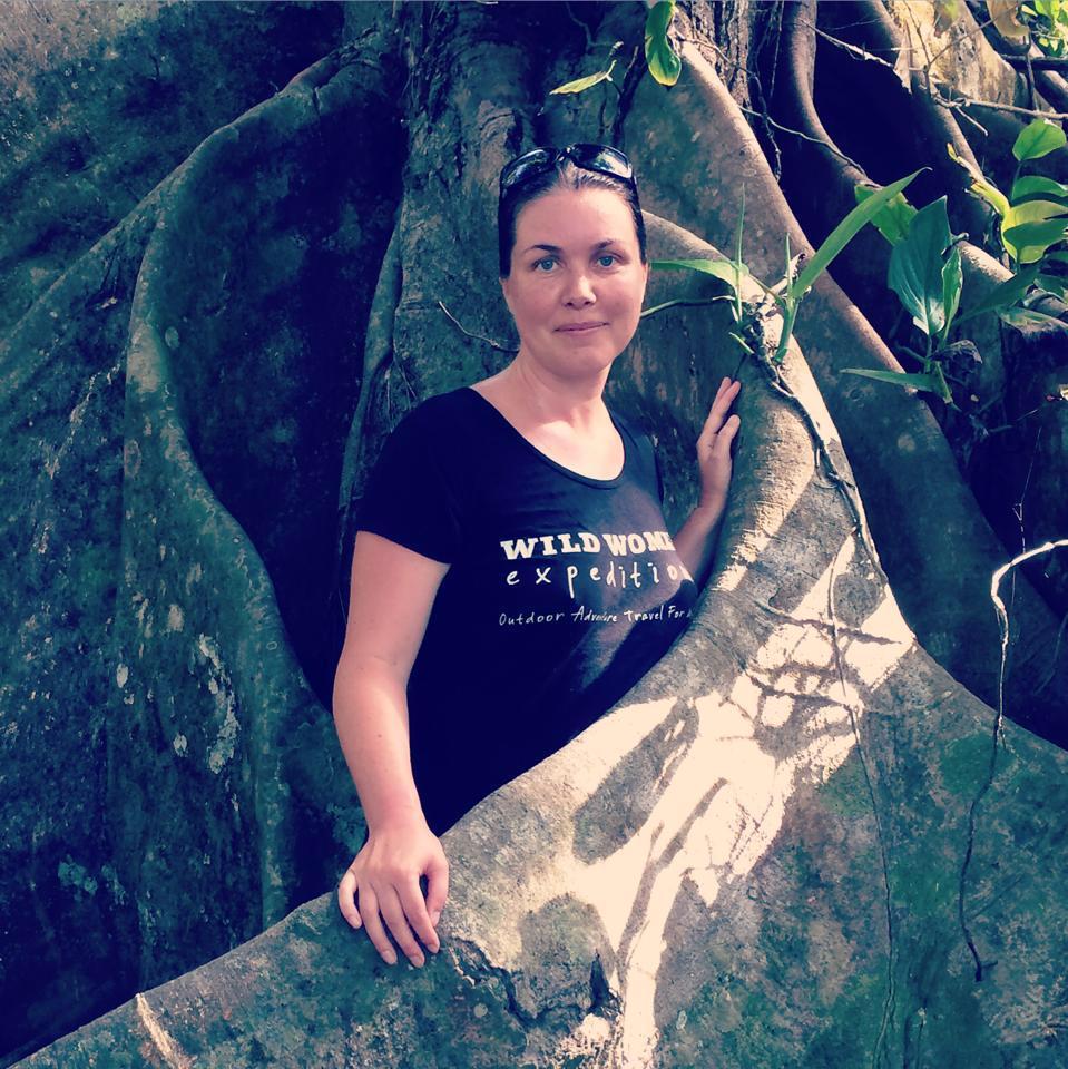 Jennifer Haddow traded in the concrete jungle for a career in adventure travel, now owner of Wild Women Expeditions. Here she poses with a tree in Corcovado National Park in Costa Rica
