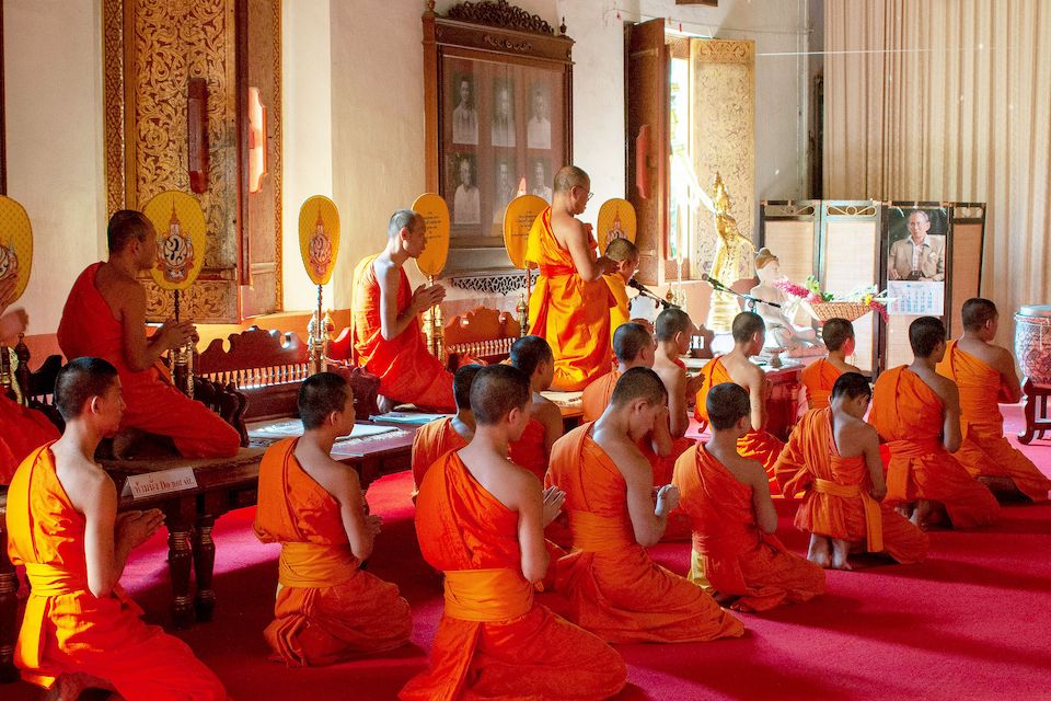 Buddhist Monks at prayer in Thailand | Photo by Diana Moore-Ede