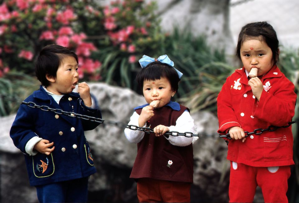 Group of three children in Shangai, China | Photo by Diana Moore-Ede