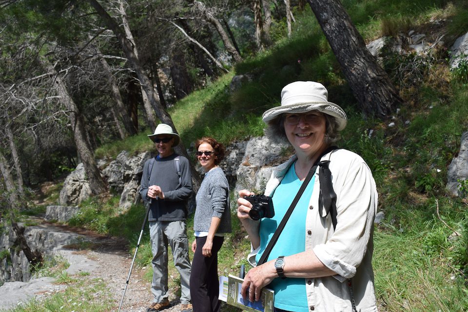 Pauline's passion is hiking, and she and husband Steve (far left) build trips around it, like this one to Positano with friends. It helps her understand if she could see herself living in a place full-time, as hiking is a big part of her life in UK.jpg
