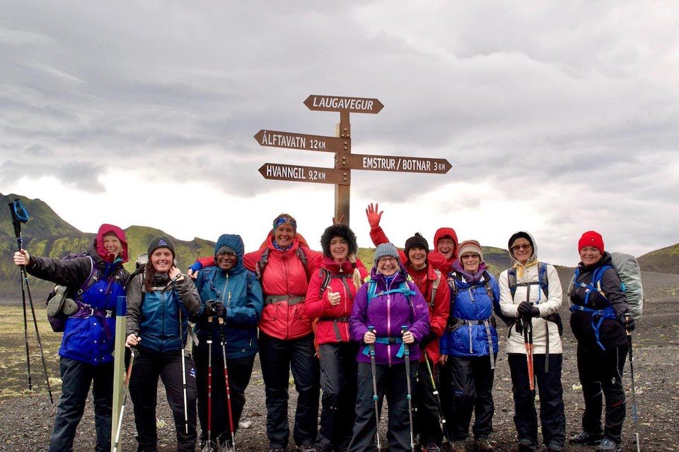 A group pf women on a mountain part of a Wild Women Expeditions tour