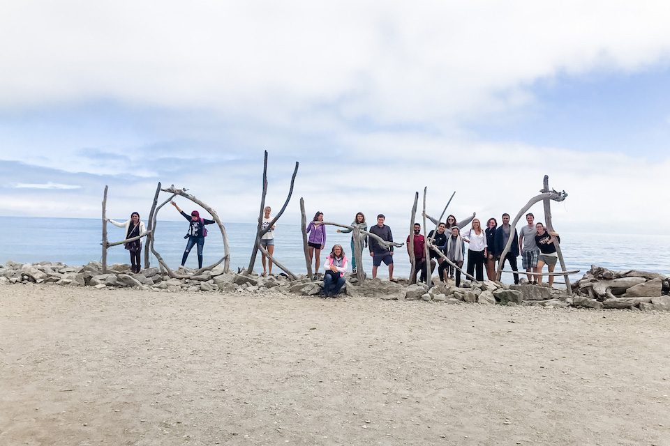 Amanda (sixth from right) and her Haka Tours crew on the beaches of Hokitika