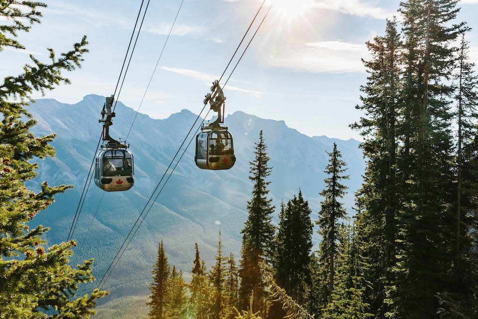 Two cable cars riding along a gondola in Banff