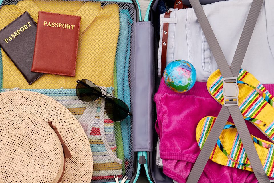 Close up of packed suitcase using these expert packing tips