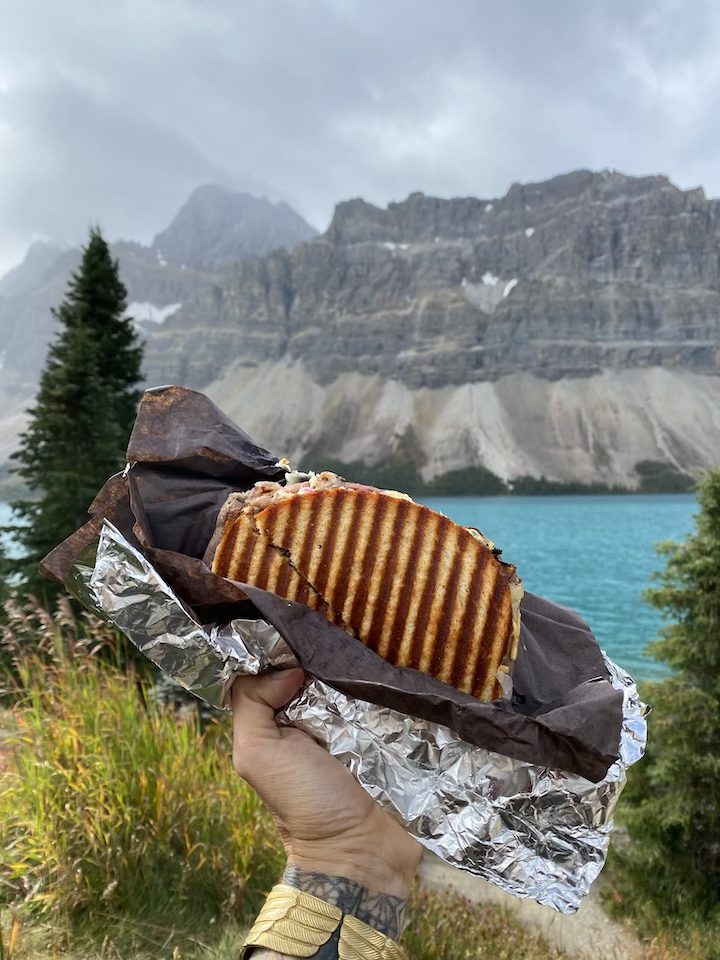 Next-level sammy from Trail Head Cafe in Lake Louise, eaten at stunning Bow Lake